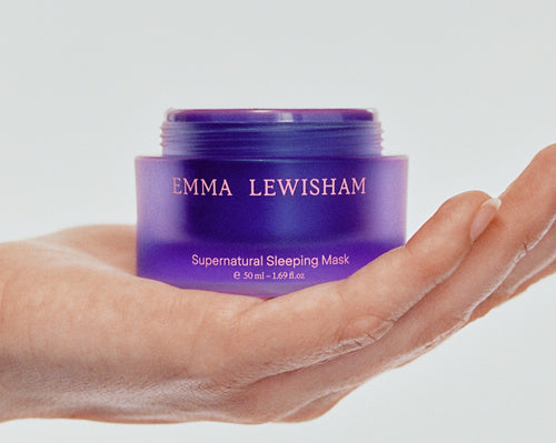 Woman holding a jar of Supernatural Sleeping Mask