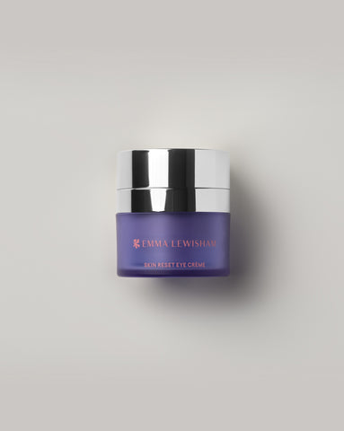 Emma Lewisham Skin Reset Eye Creme in a purple frosted glass jar with silver metallic lid, displayed against a light gray background.