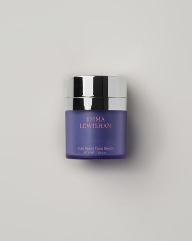 Emma Lewisham Skin Reset Face Serum in a purple frosted glass jar with silver metallic lid, 30ml (1.01 fl.oz), displayed against a light gray background.