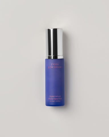 Emma Lewisham Supernatural Vitale Face Elixir in a sleek purple bottle with silver cap against a minimalist white background.